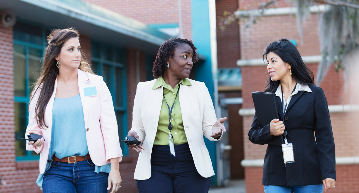 Principals and administrators conversing