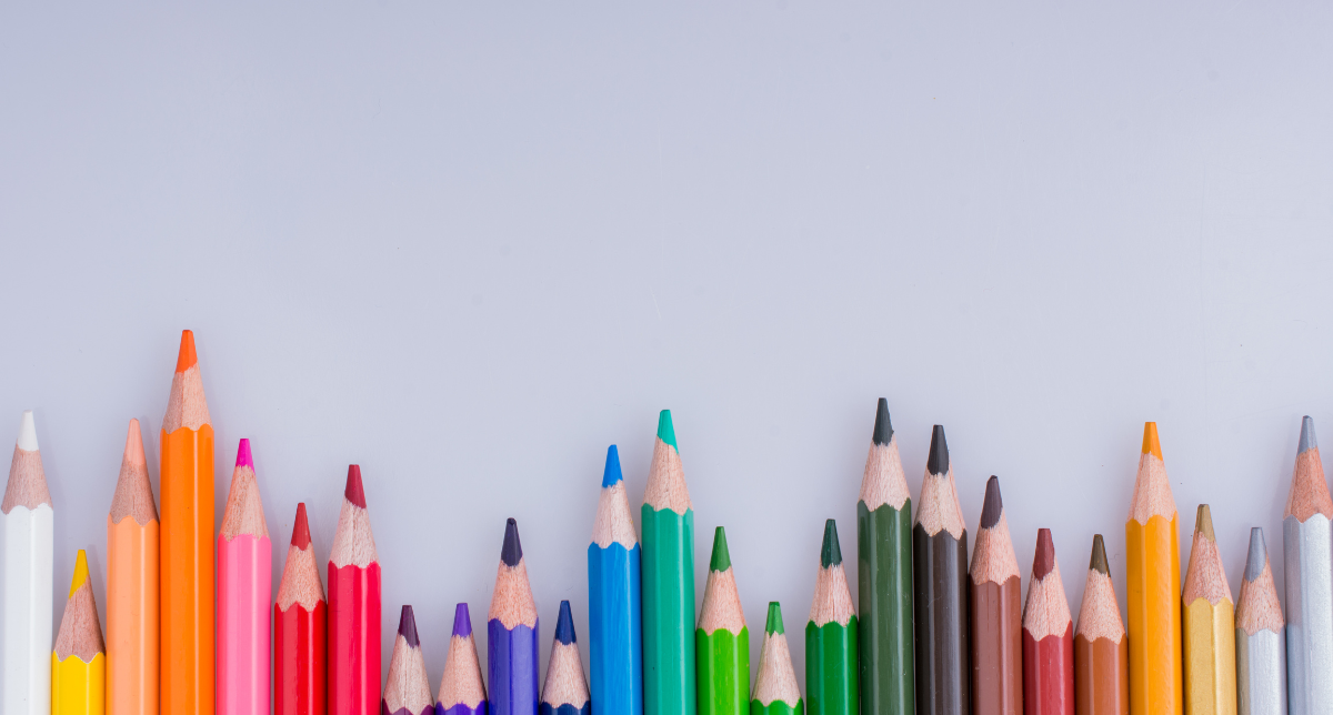 Graphic of colorful pencils against a grey background